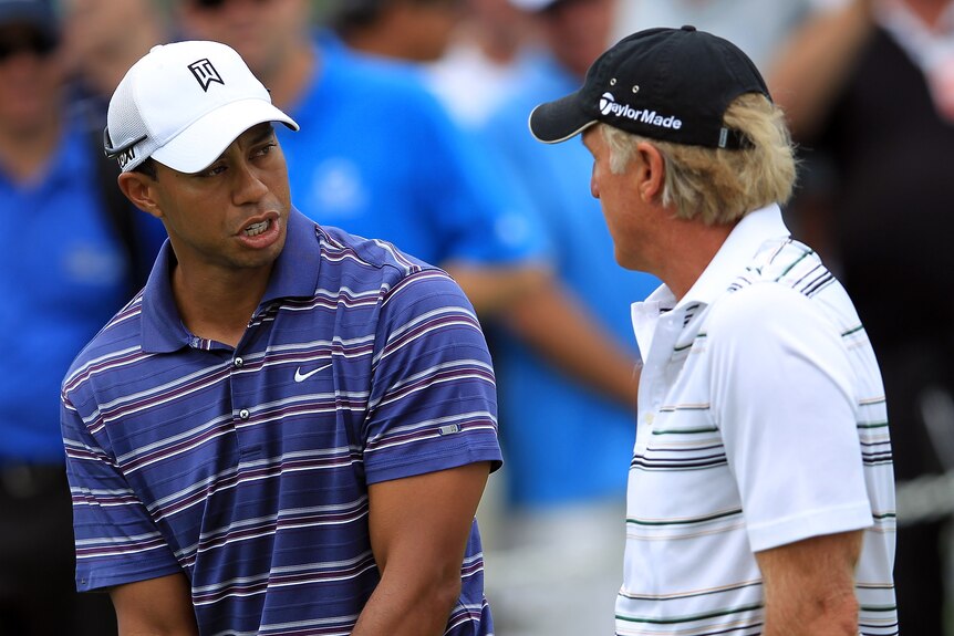 Tiger Woods and Greg Norman talk during practice for the 2011 Australian Open in Sydney