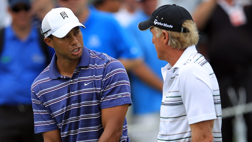 Tiger Woods and Greg Norman talk during practice for the 2011 Australian Open in Sydney