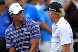 Tiger Woods and Greg Norman talk during practice for the 2011 Australian Open in Sydney