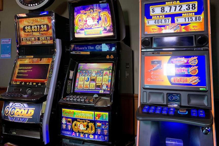 Three poker machines lined up.