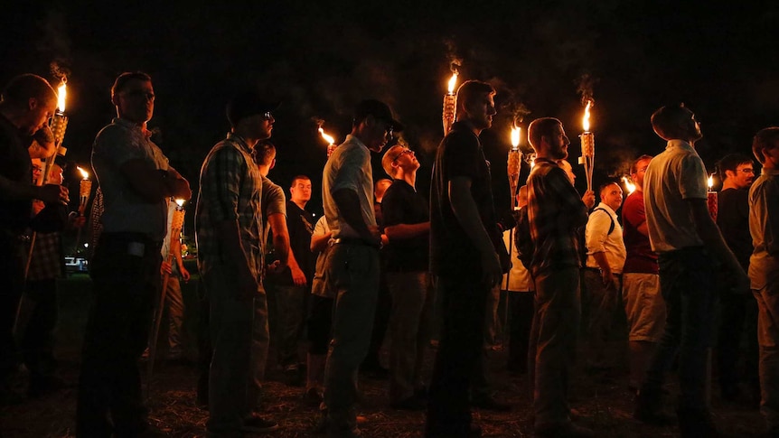 People march in the darkness with torches