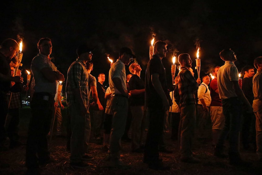 People march in the darkness with torches