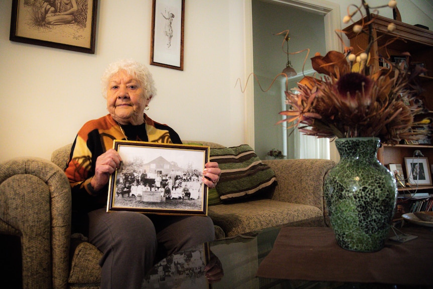 Fay Carter holds a photo of her ancestors on Cummeragunja.