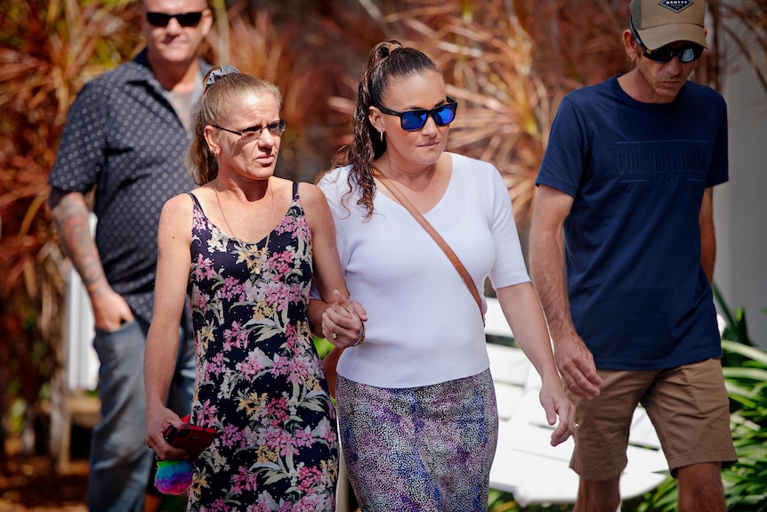 Danielle Kellett (centre, right) leaves Darwin Local Court with friends and family.