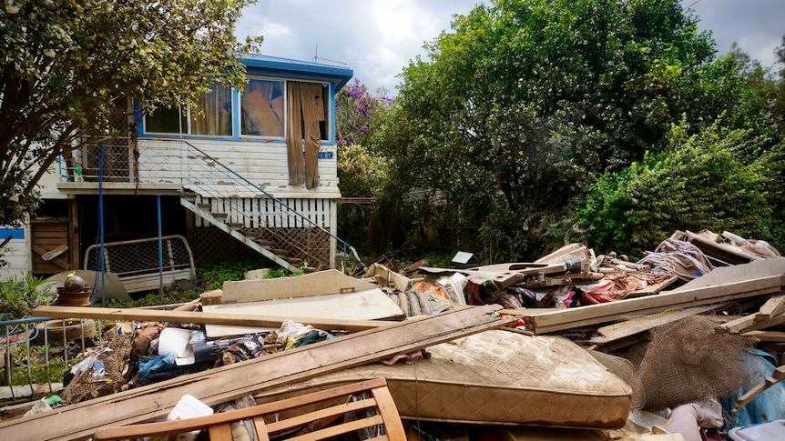 Destroyed household items outside a Lismore home after the 2022 floods.