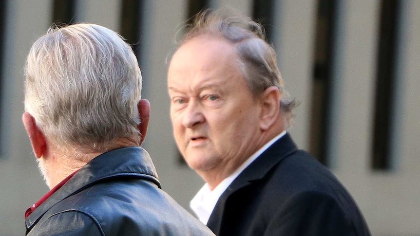 Martin Cooper with another man, leaving a Perth court.