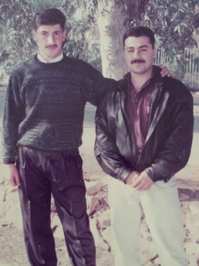 Iraqi refugee Teimoor Amin (right) in Iraq with a friend