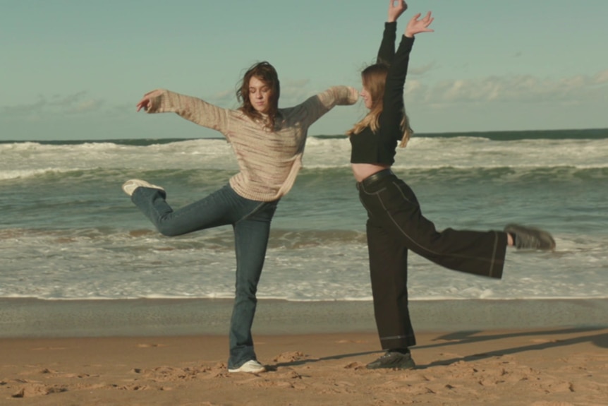 Vlada and Maria dancing on the shores of Dee Why beach in Sydney, Australia