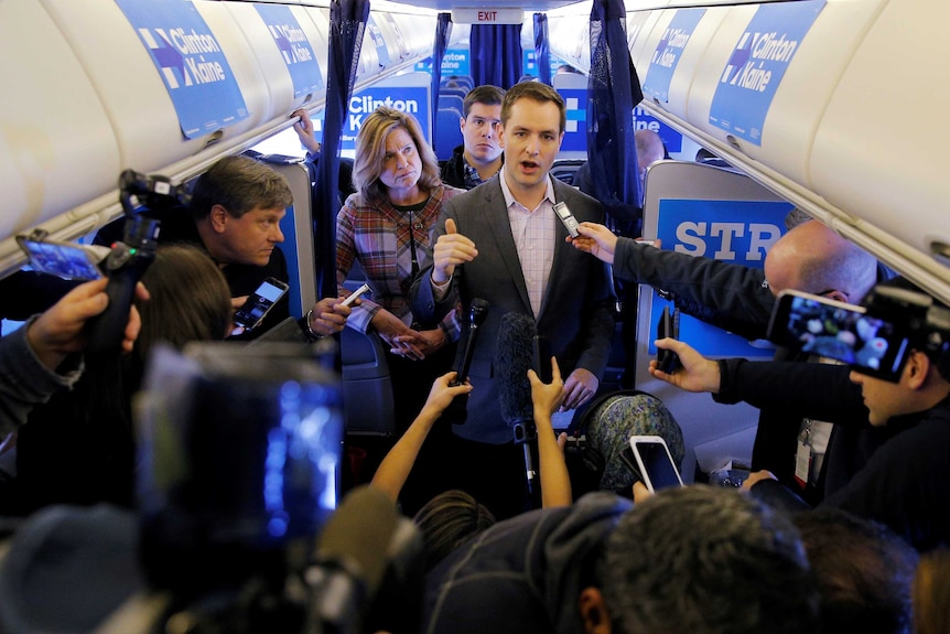 Robby Mook, Campaign manager for US Democratic presidential nominee Hillary Clinton talks to reports onboard the campaign plane en route to cedar rapids, October 29, 2016.