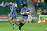 Tatafu Polota-Nau carries a rugby ball while playing for the Western Force, with a teammate to his right.