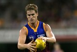 Luke Power squares up a shot for the Brisbane Lions