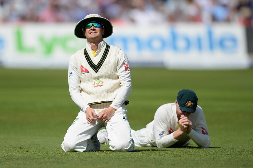 Missed chances ... Australia captain Michael Clarke (L) and Steven Smith react after dropping Alastair Cook