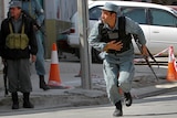 Afghan police take their positions as Kabul comes under fire.