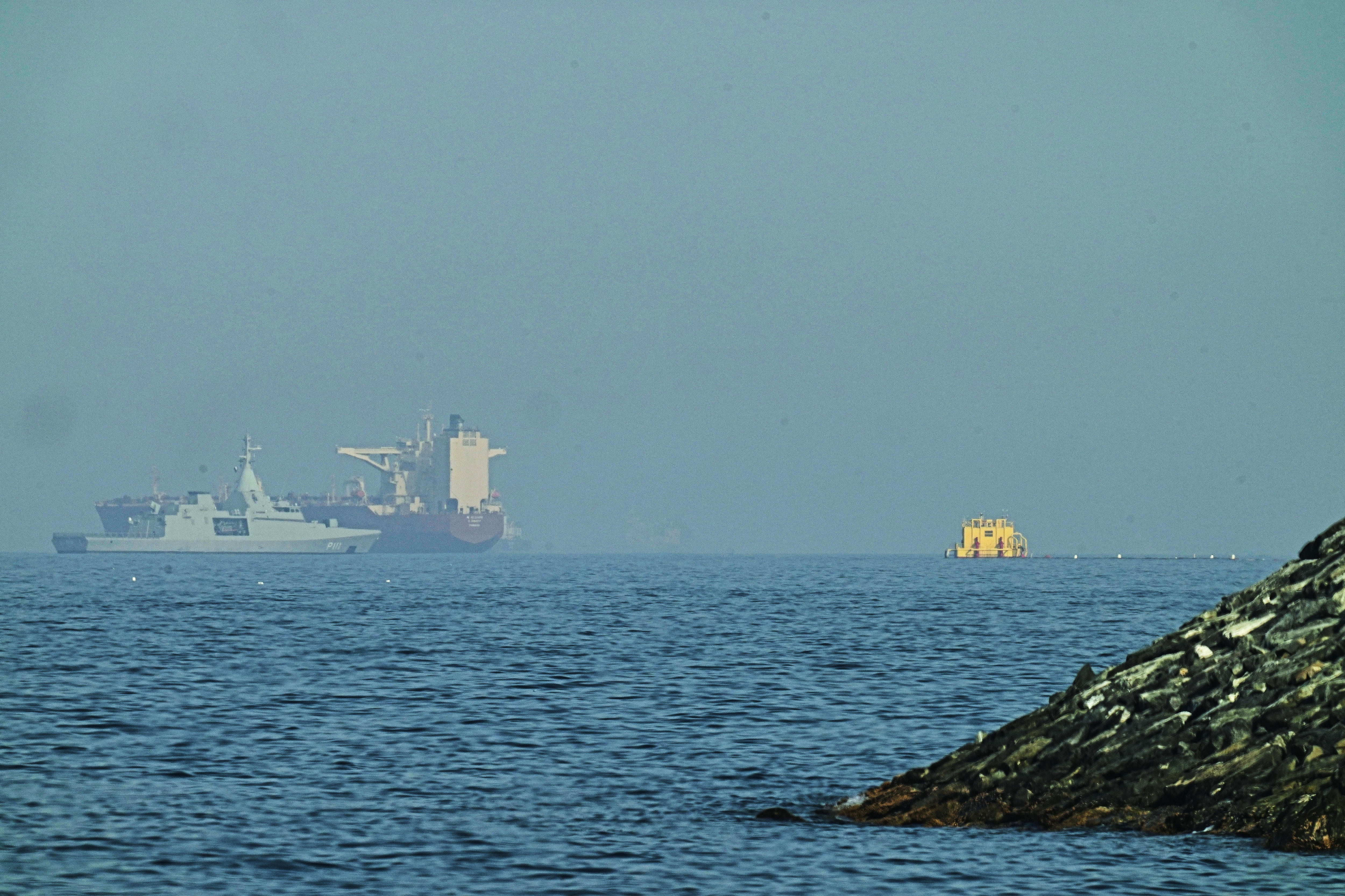 Cargo ship in Strait of Hormuz says it was attacked as peace negotiations continue
