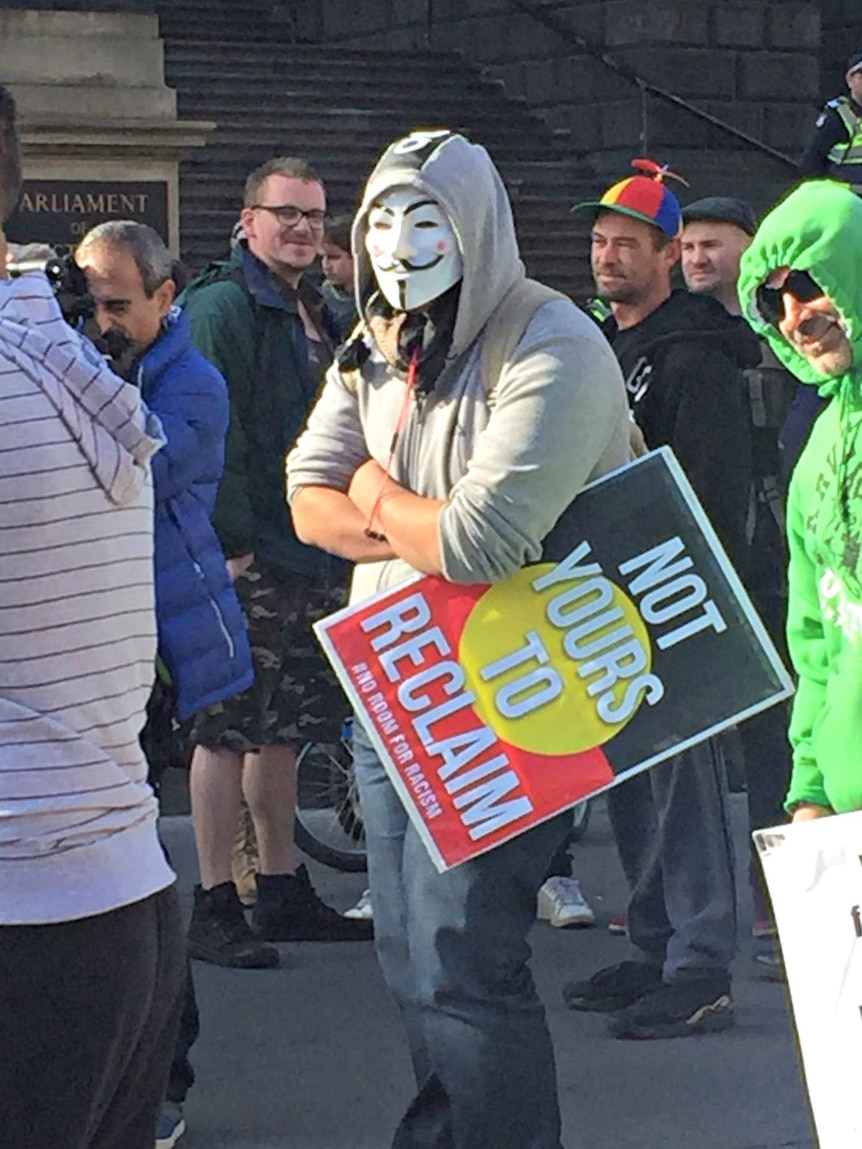Anti-racism protester wearing mask at Melbourne rally