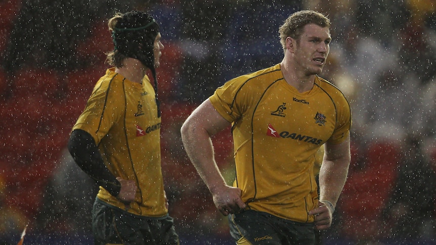 Much to ponder ... Wallabies captain David Pocock (R) looks dejected after losing to Scotland