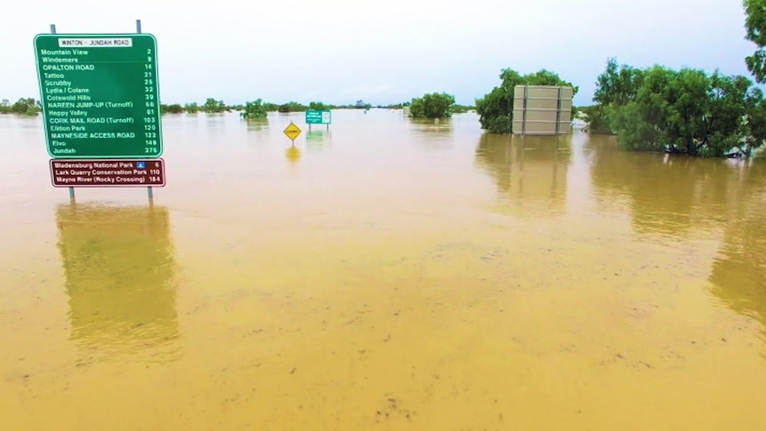 Drone footage of a flooded road near the central-west Queensland town of Winton.