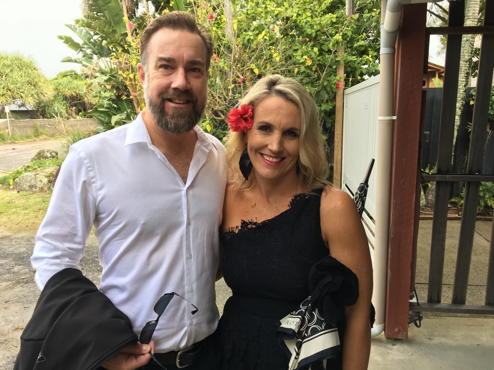 Tara Castle smiles while standing next to her late husband.