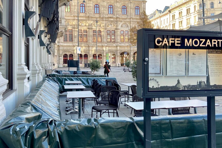 An empty outdoor cafe in the middle of Vienna