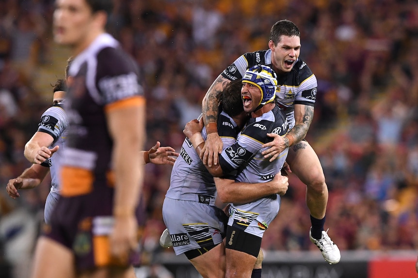 Johnathan Thurston reacts after his winning field goal for the Cowboys against the Broncos
