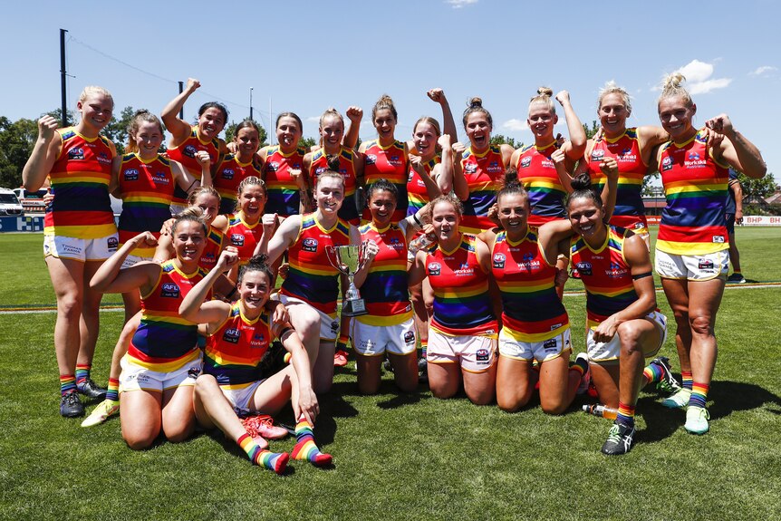  Adelaide Crows pose for a photo with the BHP Cup after winning their round 3 match against West Coast Eagles in the ALFW