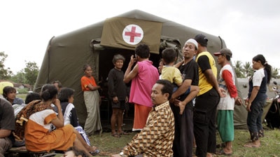 Villagers queue for treatment at a tent hospital in Bantul, near Yogyakarta.