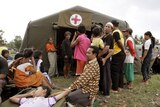 Villagers queue for treatment at a tent hospital in Bantul, near Yogyakarta.