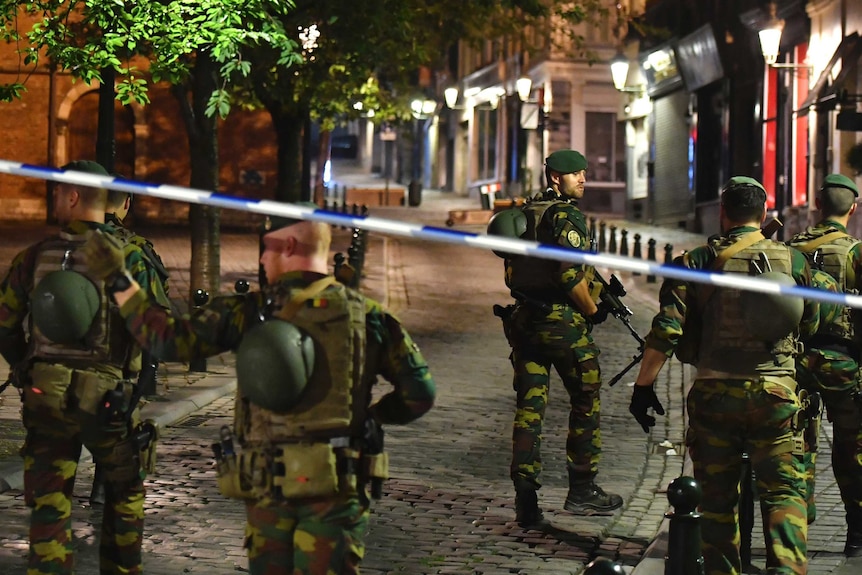 Belgian Army soldiers patrol streets near Central Station in Brussels