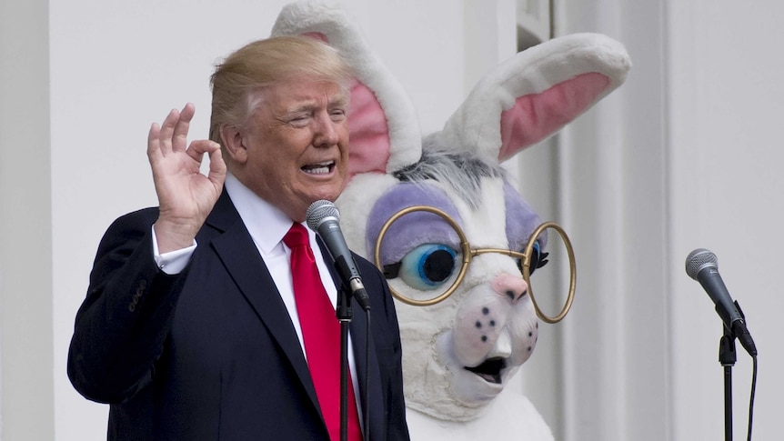 Donald Trump alongside a person in an Easter bunny costume.