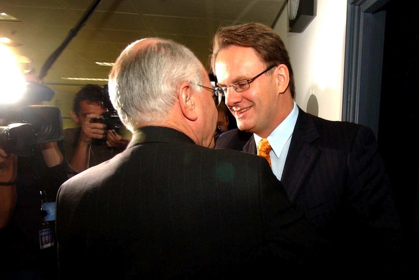 John Howard and Mark Latham shake hands