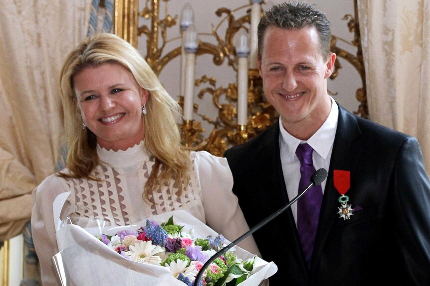 Michael Schumacher and his wife Corinna, after he was awarded the French Legion of Honour.