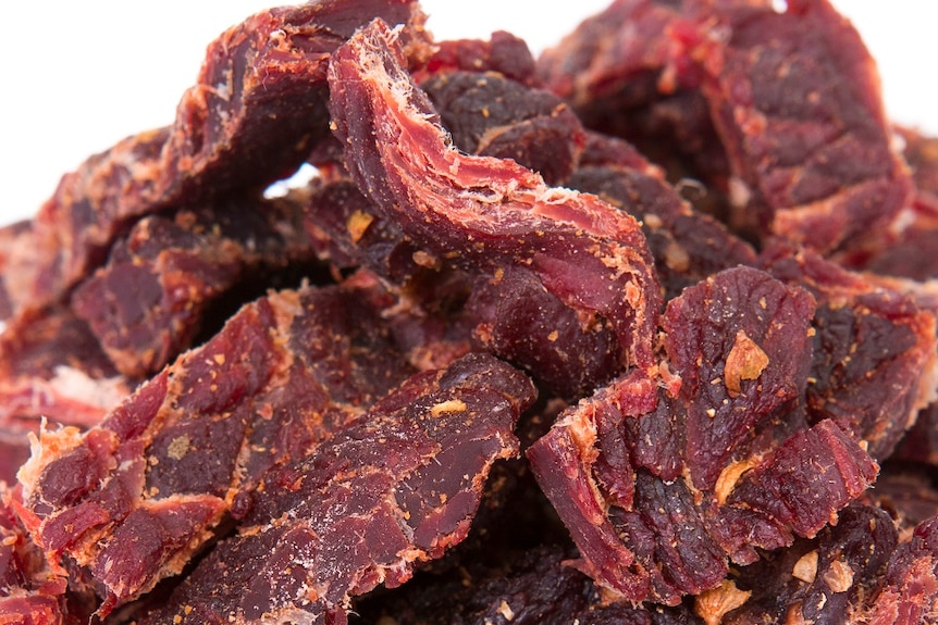 A close up of beef jerky.