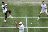 Serena Williams belts the ball at Fabrice Martin with Andy Murray alongside.