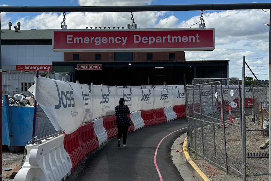 A woman walks into the emergendy department
