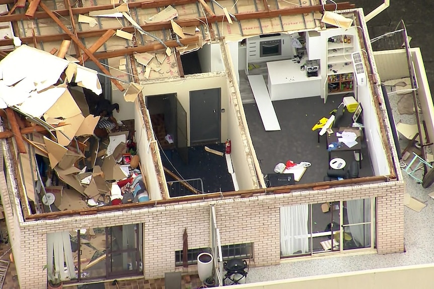 a building with roof ripped off