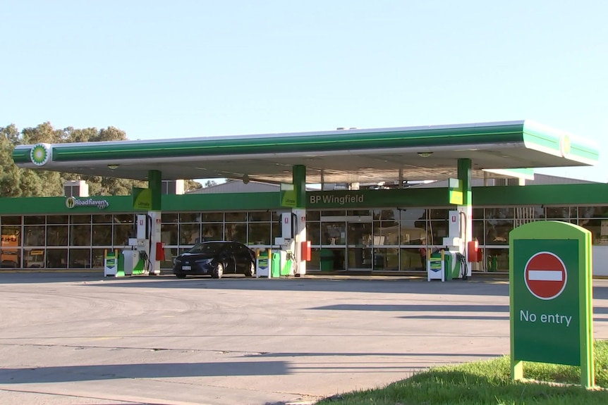 The forecourt of a three-bowser petrol station with green BP livery and a small green sign "No entry" on the right