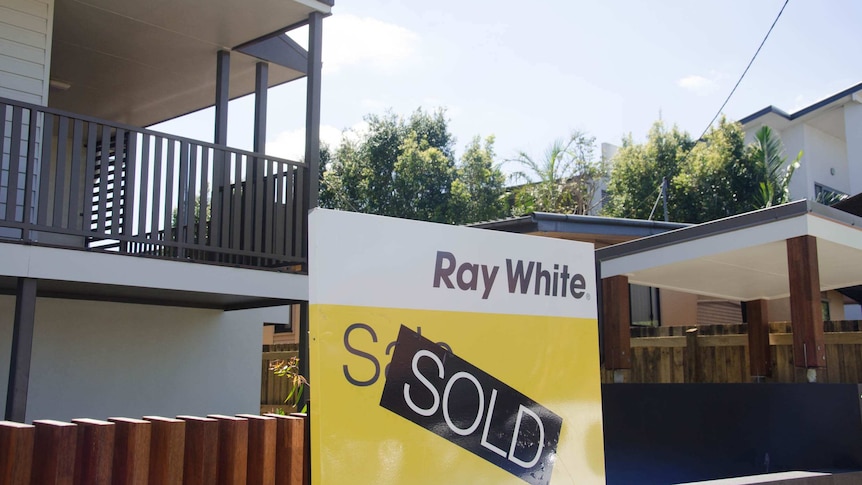 A Ray White 'Sold' sign outside a house in Brisbane