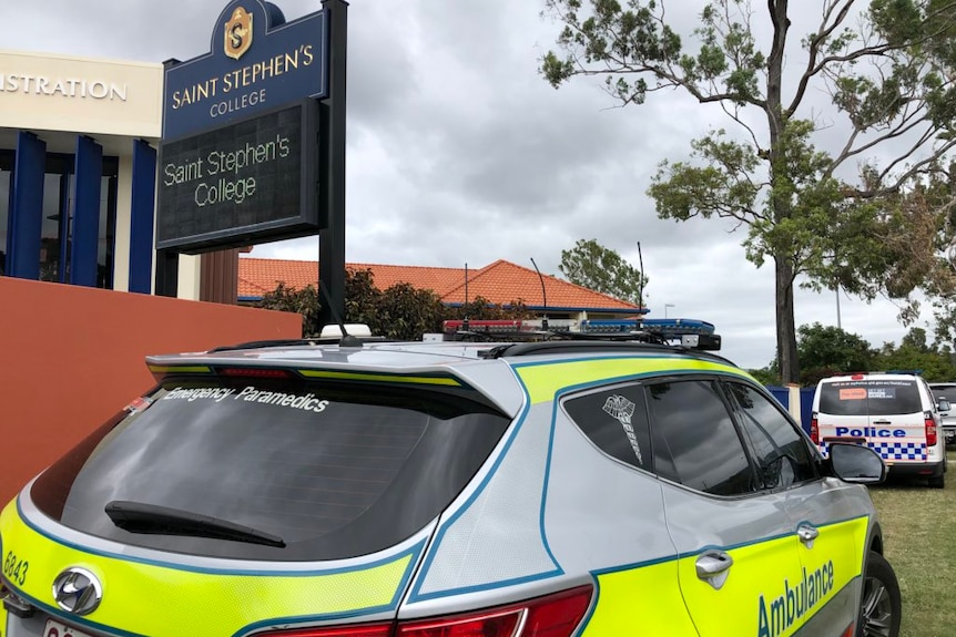 Ambulance and police car outside Saint Stephen's College