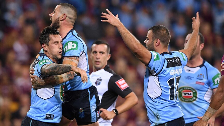 Mitchell Pearce and the Blues celebrate his try against the Maroons during Origin I.