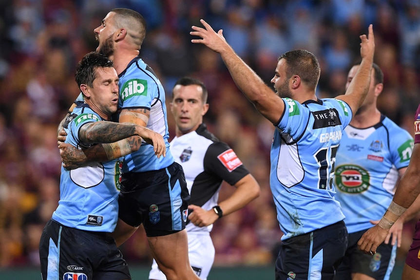 The Blues celebrate Mitchell Pearce's try against the Maroons