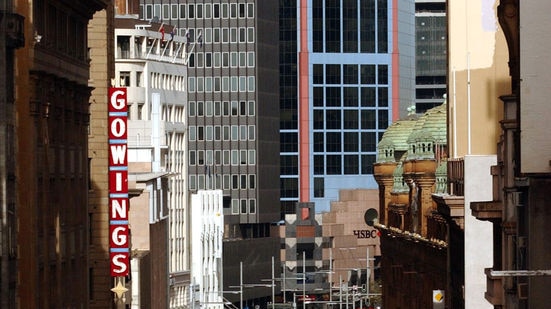 Vehicles make their way down George Street, Sydney