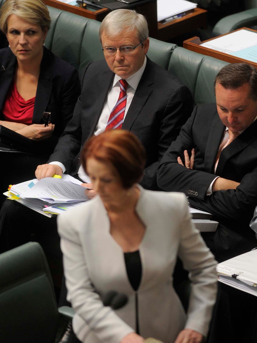 Julia Gillard speaks in Parliament with Foreign Minister Kevin Rudd in the background