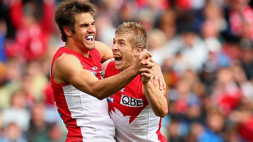 Josh Kennedy and Keiran Jack of the Swans celebrate a goal during the 2012 AFL Grand Final.