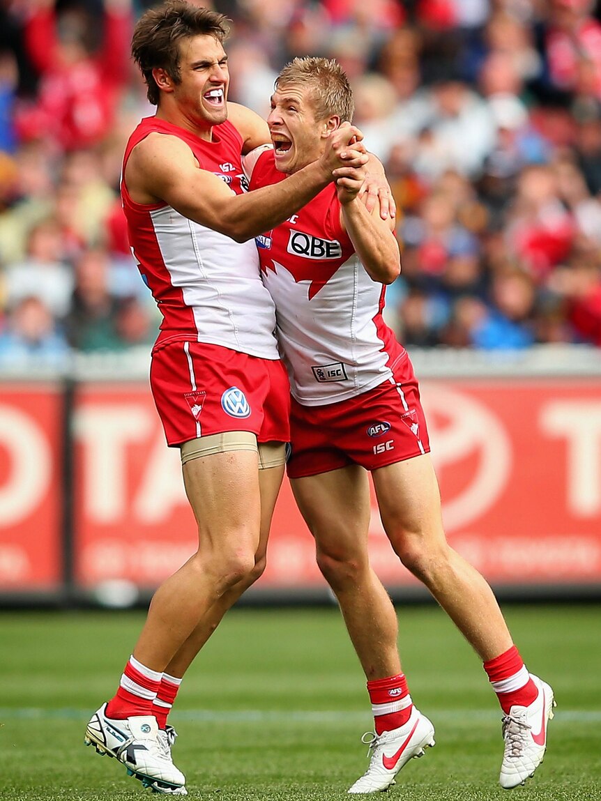 Josh Kennedy and Keiran Jack of the Swans celebrate a goal during the 2012 AFL Grand Final.