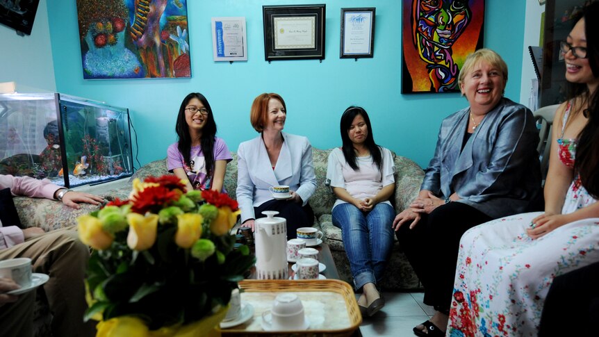 Prime Minister Julia Gillard and Families Minister Jenny Macklin visit the Huynh and Tran families in Smithfield.