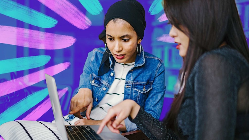 Two women look at something on their laptop for story on skills you need to stay on top of in a relationship