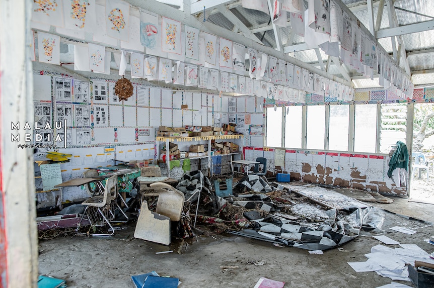 Open classroom in ruins after a tsunami in Tonga. 