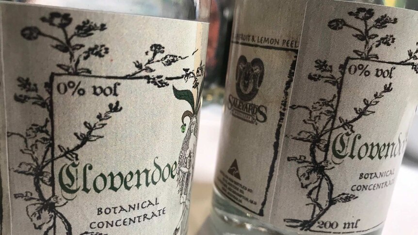 two bottles, with labels depicting botanical images.