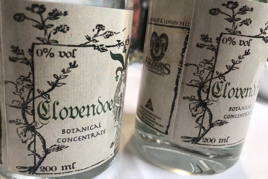 two bottles, with labels depicting botanical images.