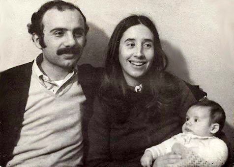 A black and white photo shows an Argentinian couple holding a baby boy.